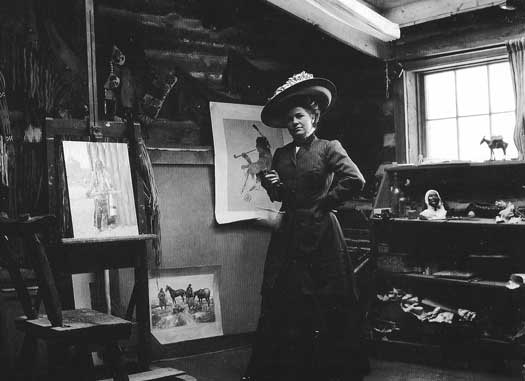Nancy, Charlie’s business manager, inside his log cabin studio